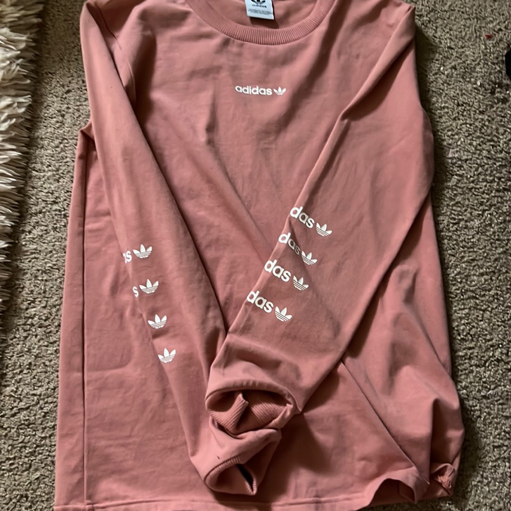 Brand new Adidas shirt never worn.